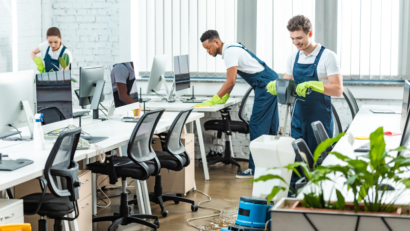Day porter cleaning staff disinfecting office surfaces in Alexandria